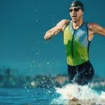 Professional triathlete swimming in river's open water